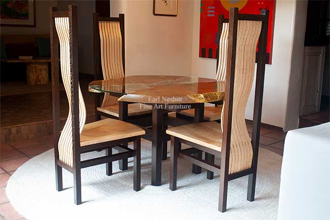 round live edge dining table shown with all four chairs